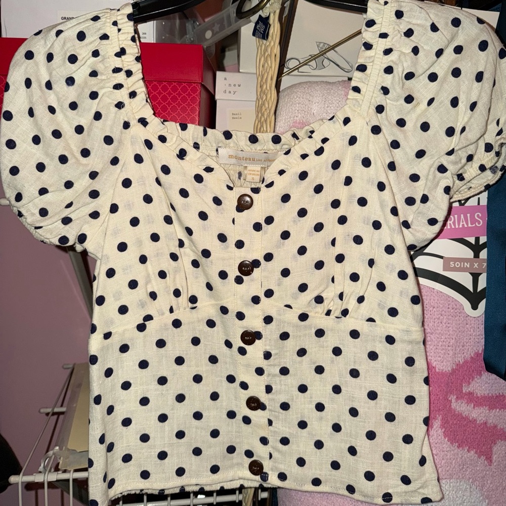 Women’s cream and navy polka dot shirt